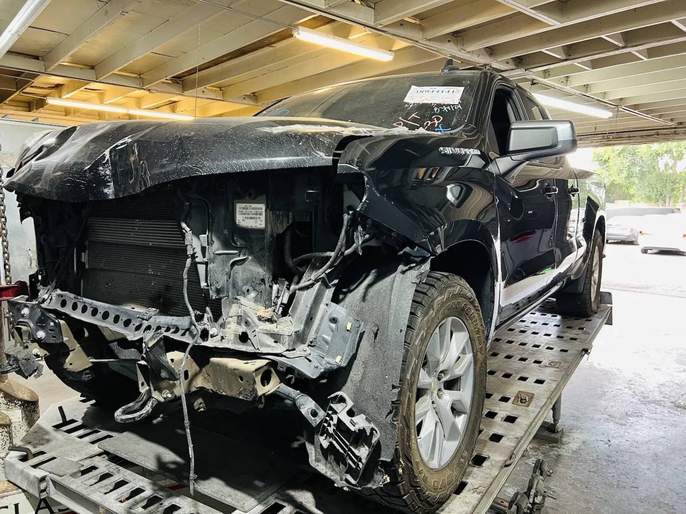 Pickup truck on a frame rack during collision repair